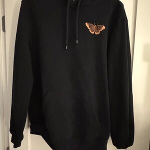 H&M Black Hoodie with Orange Butterfly Accent